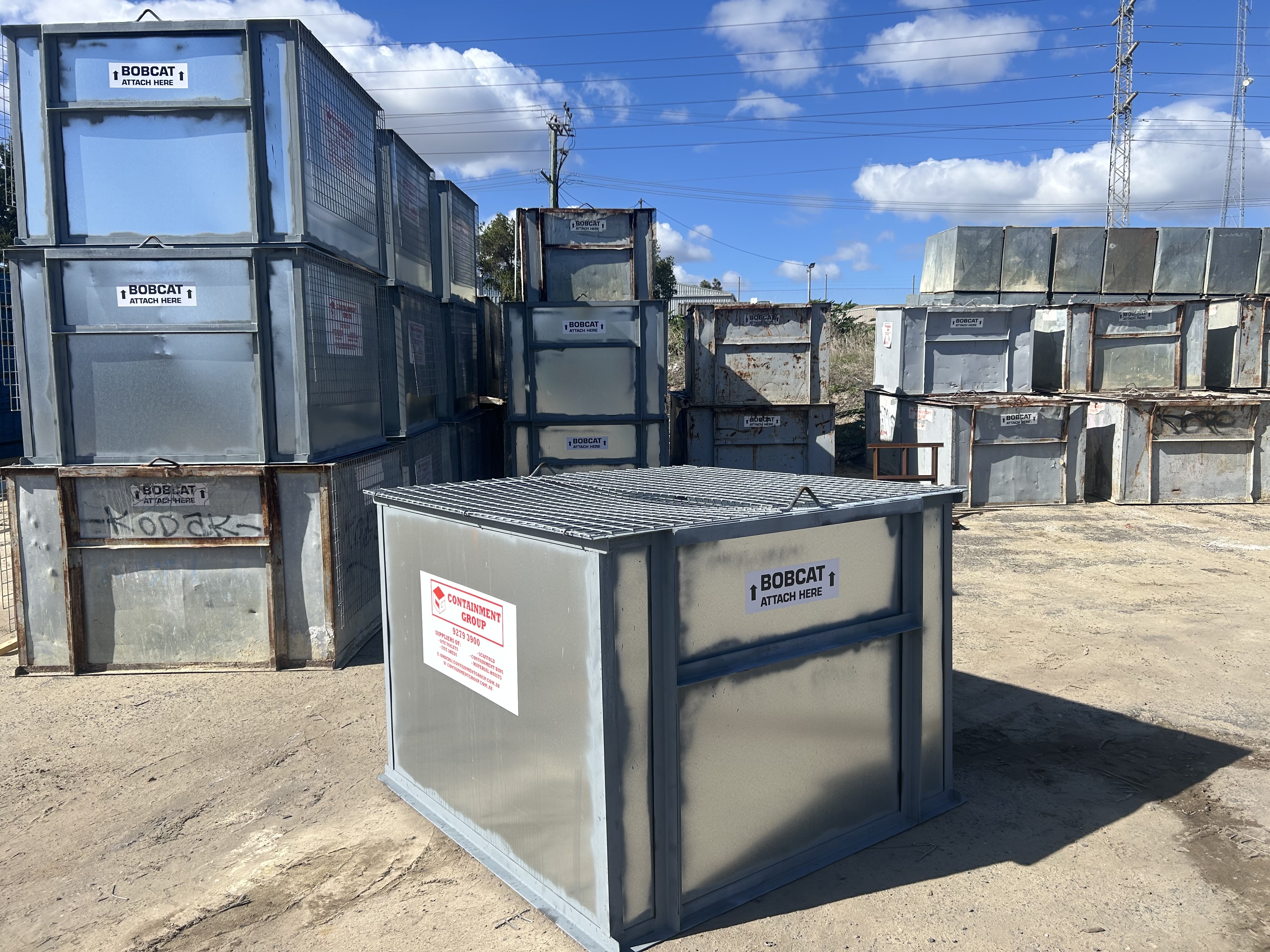 Containment Group bobcat-attach containment bins stacked at the Bibra Lake yard